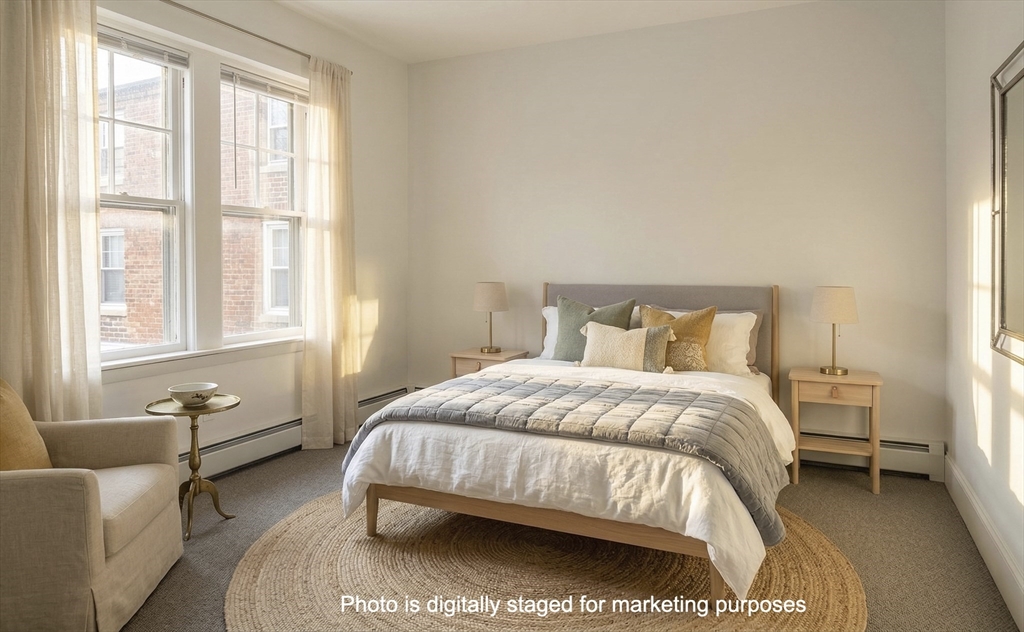 25 Chester Street, Unit 3 Boston, MA 02134 - Photo 6 of 14 a bedroom with a bed and window