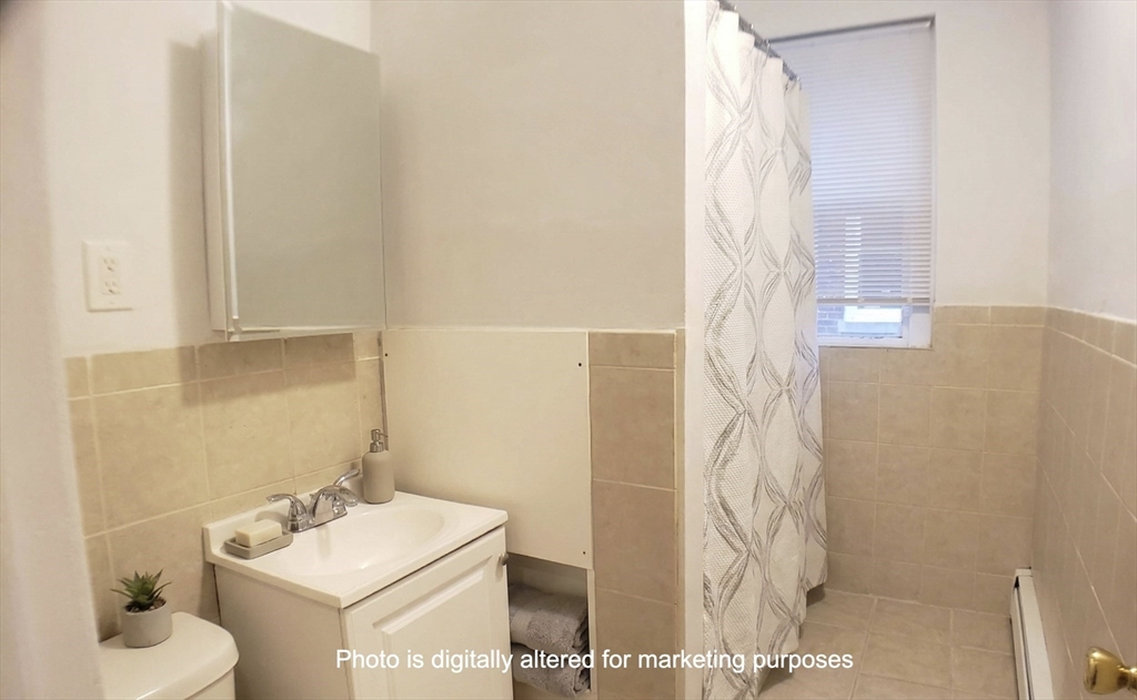 25 Chester Street, Unit 3 Boston, MA 02134 - Photo 8 of 14 a bathroom with a sink toilet and shower