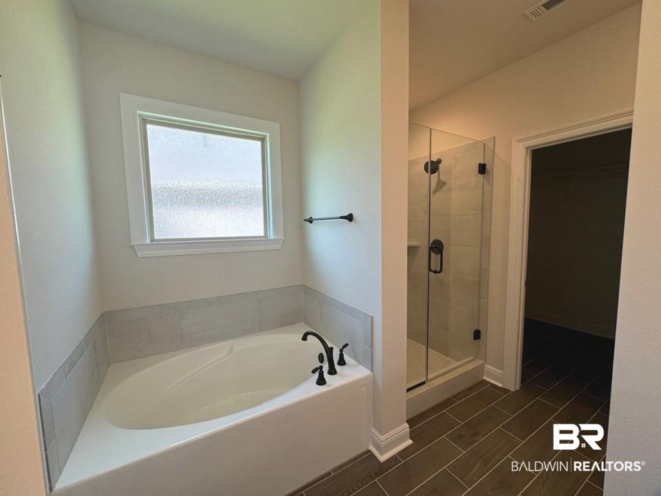 844 Sumter Loop Foley, AL 36535 - Photo 11 of 18 Bathroom with tile patterned flooring and separate shower and tub