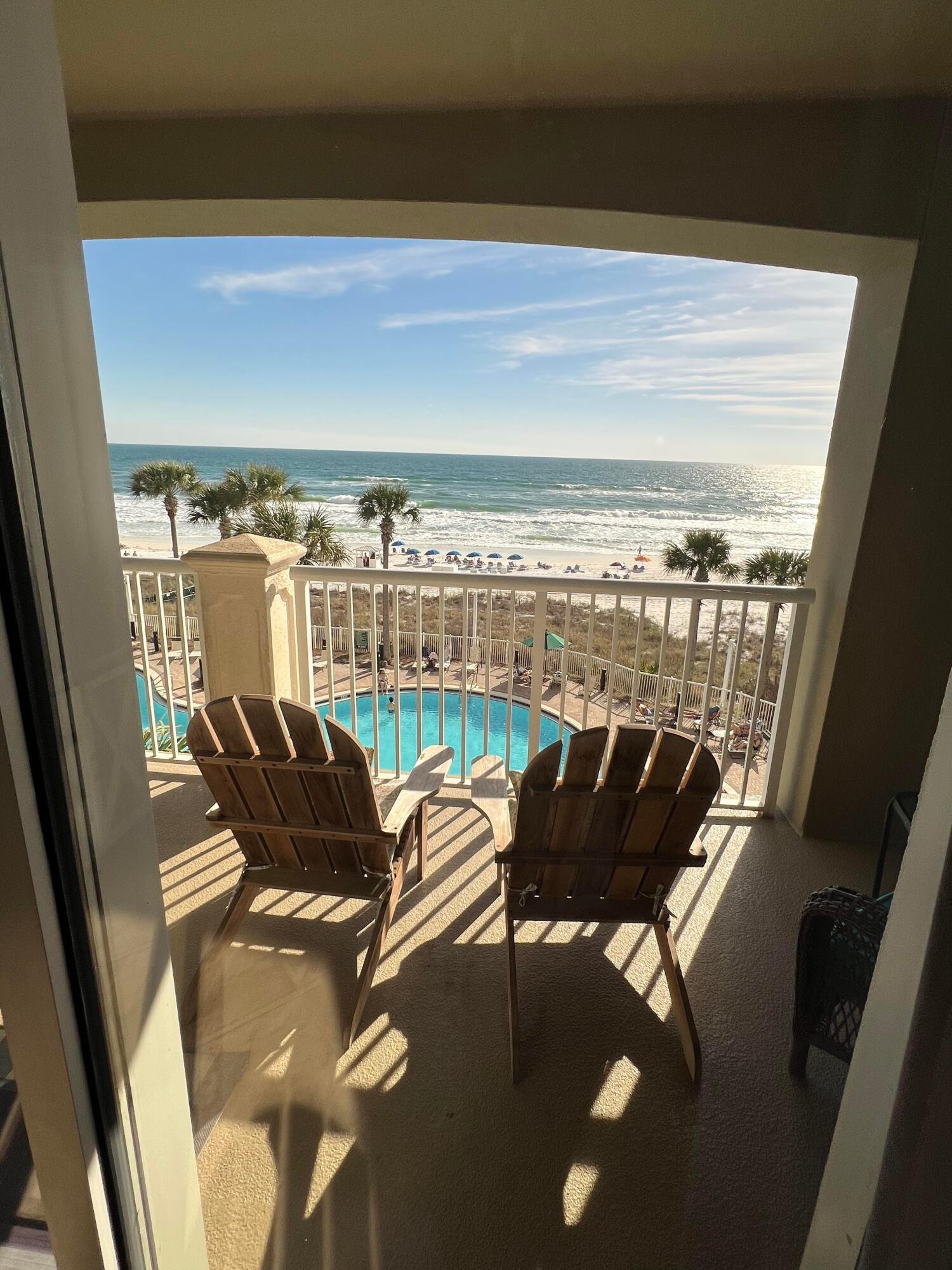 11807 Front Beach Road, Unit 1402 Panama City Beach, FL 32407 - Photo 15 of 37 a view of a chairs and table in patio