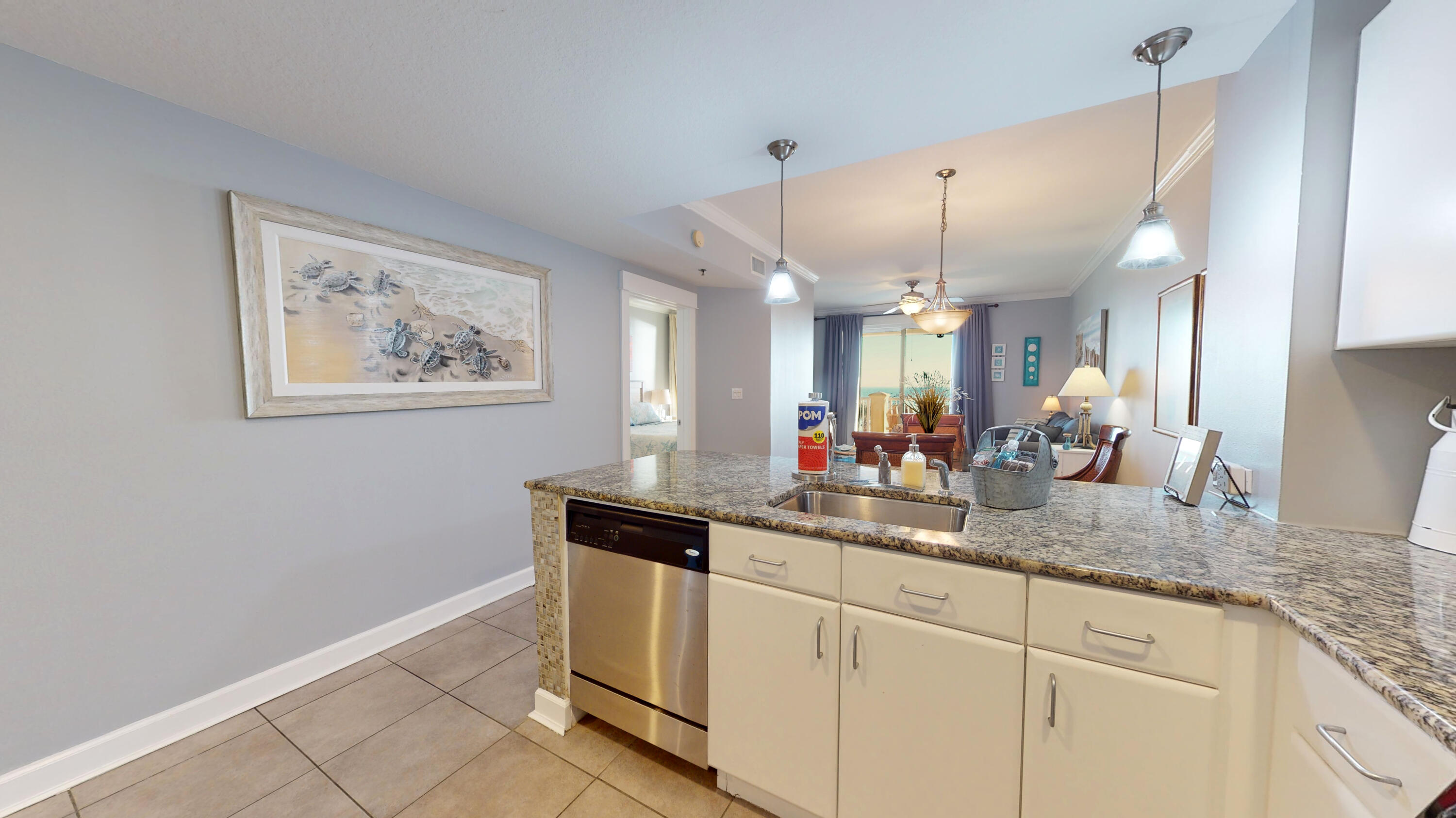 11807 Front Beach Road, Unit 1402 Panama City Beach, FL 32407 - Photo 18 of 37 a kitchen with cabinets and window
