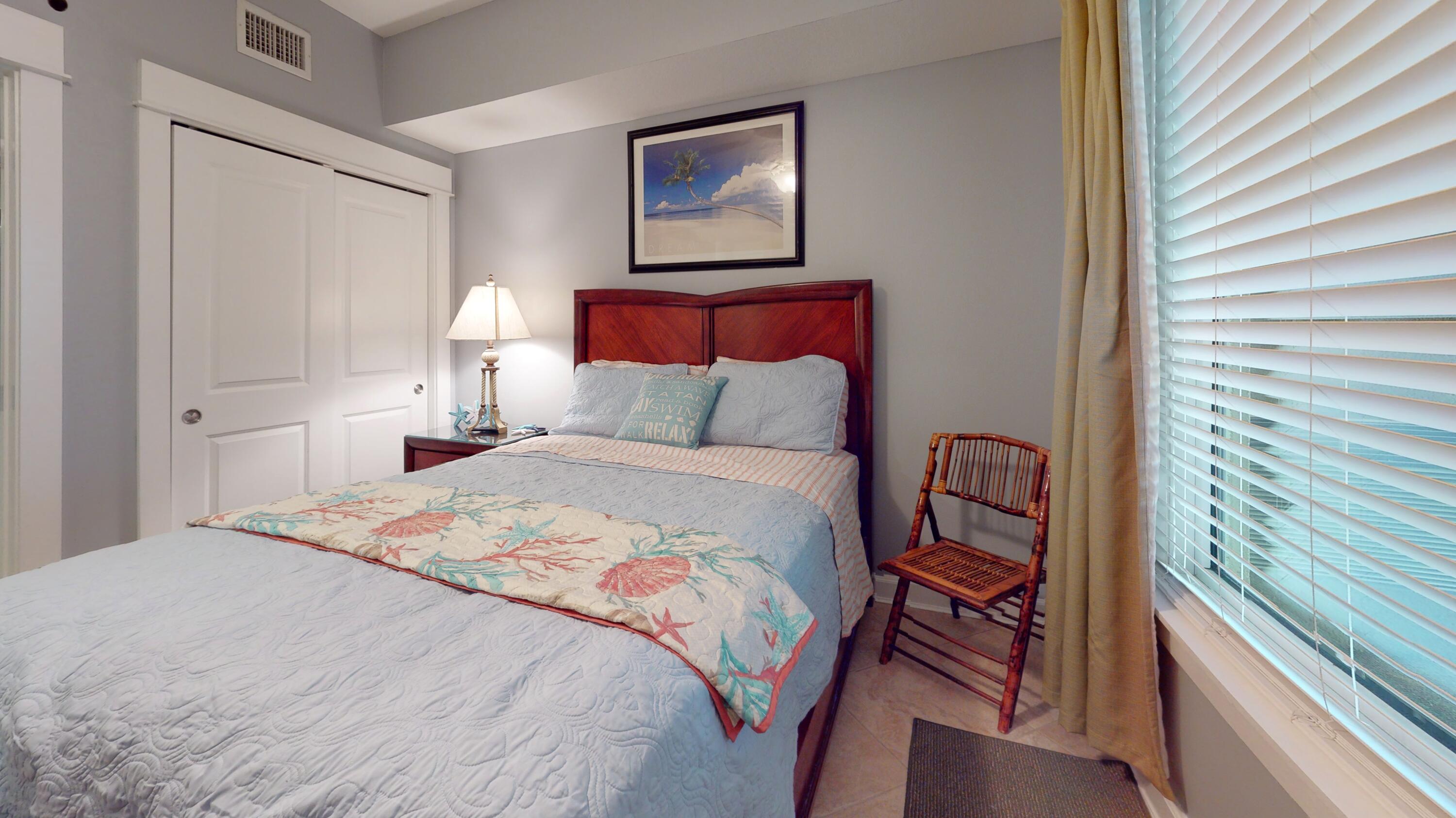 11807 Front Beach Road, Unit 1402 Panama City Beach, FL 32407 - Photo 26 of 37 a bedroom with a bed and a window