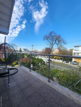 a view of a park with iron fence