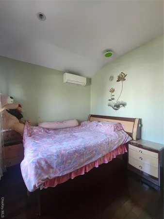 a bedroom with a bed and a table