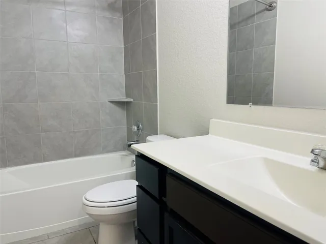 a bathroom with a sink a toilet and a bathtub