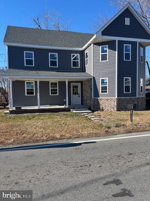 5026 Bethlehem Road Preston, MD 21655 - Photo 1 of 2 a front view of a house with a yard