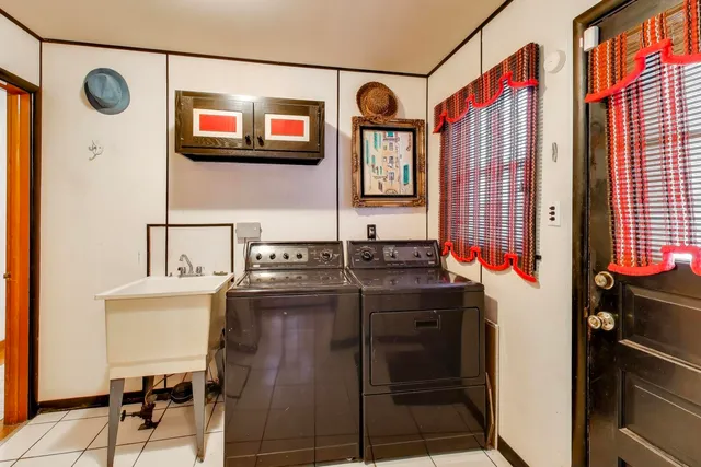 a bedroom with a bed and a ceiling fan