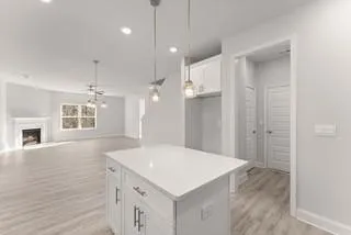 a view of kitchen with cabinets and wooden floor