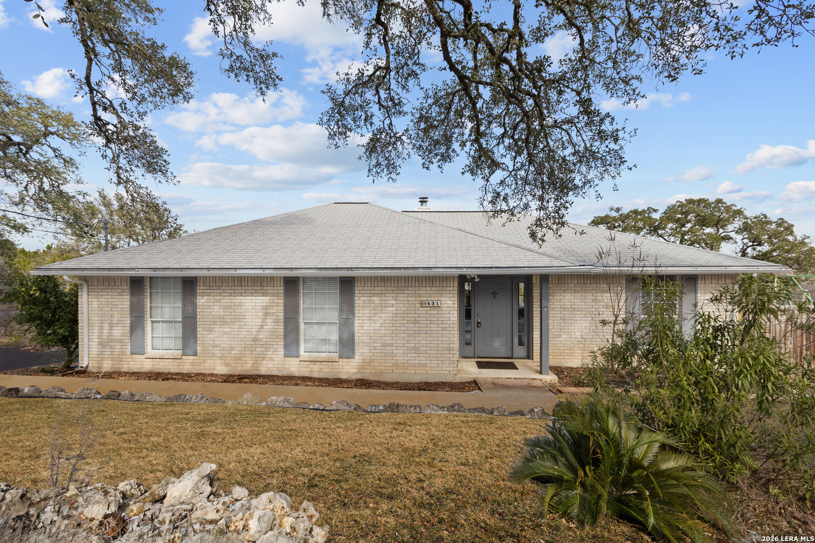 front view of a house with a yard