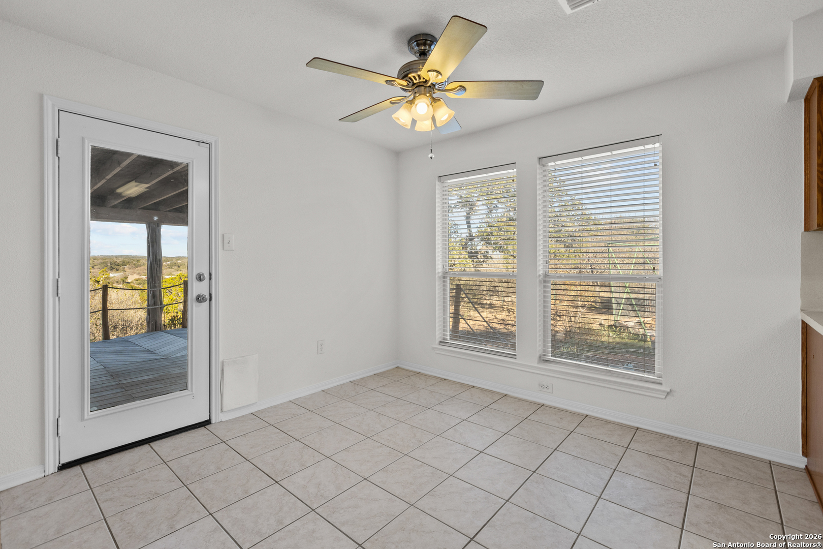 431 Windy Hill Drive Spring Branch, TX 78070 - Photo 12 of 45 a view of an empty room with a window