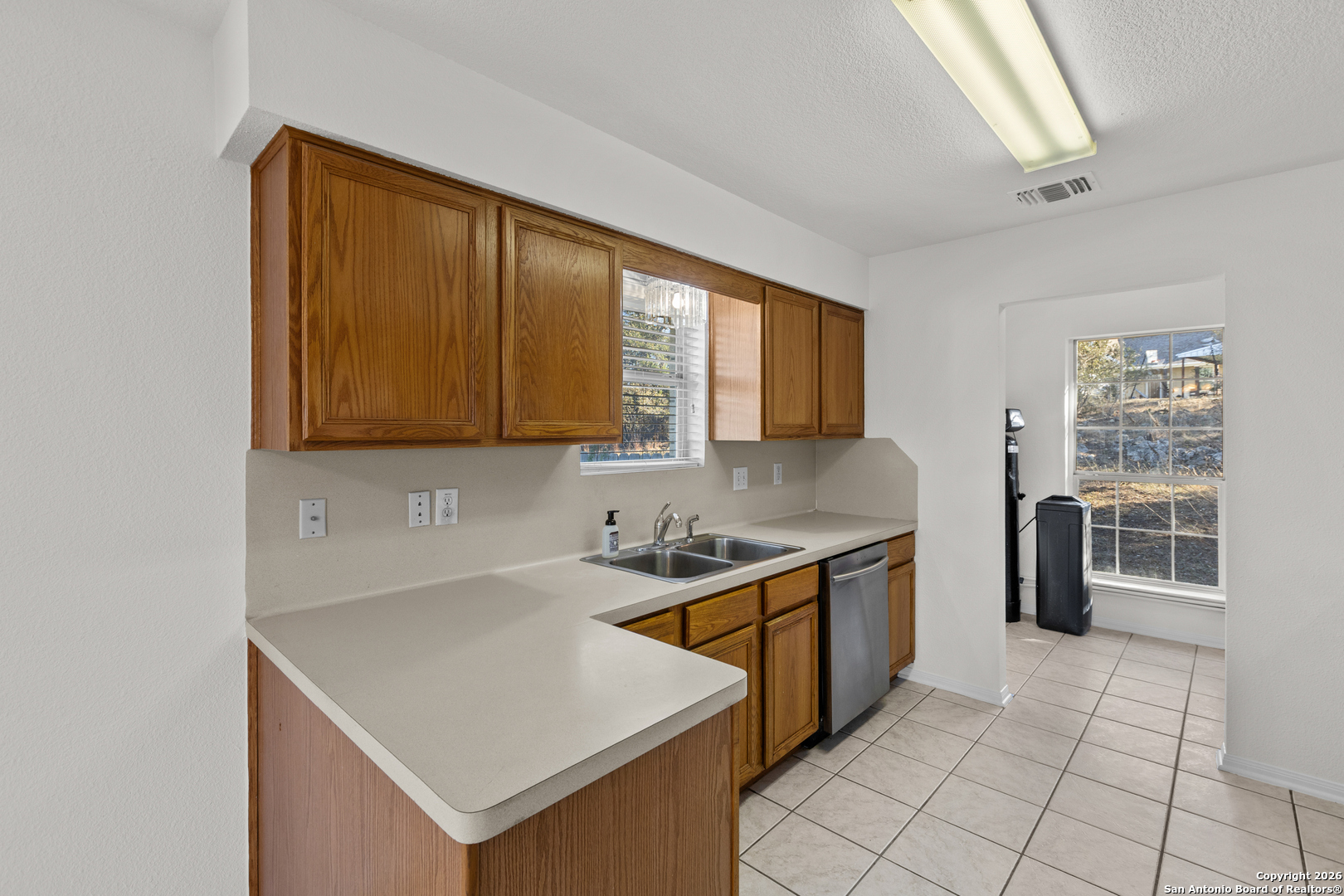 431 Windy Hill Drive Spring Branch, TX 78070 - Photo 15 of 45 a kitchen that has a sink and a stove in it