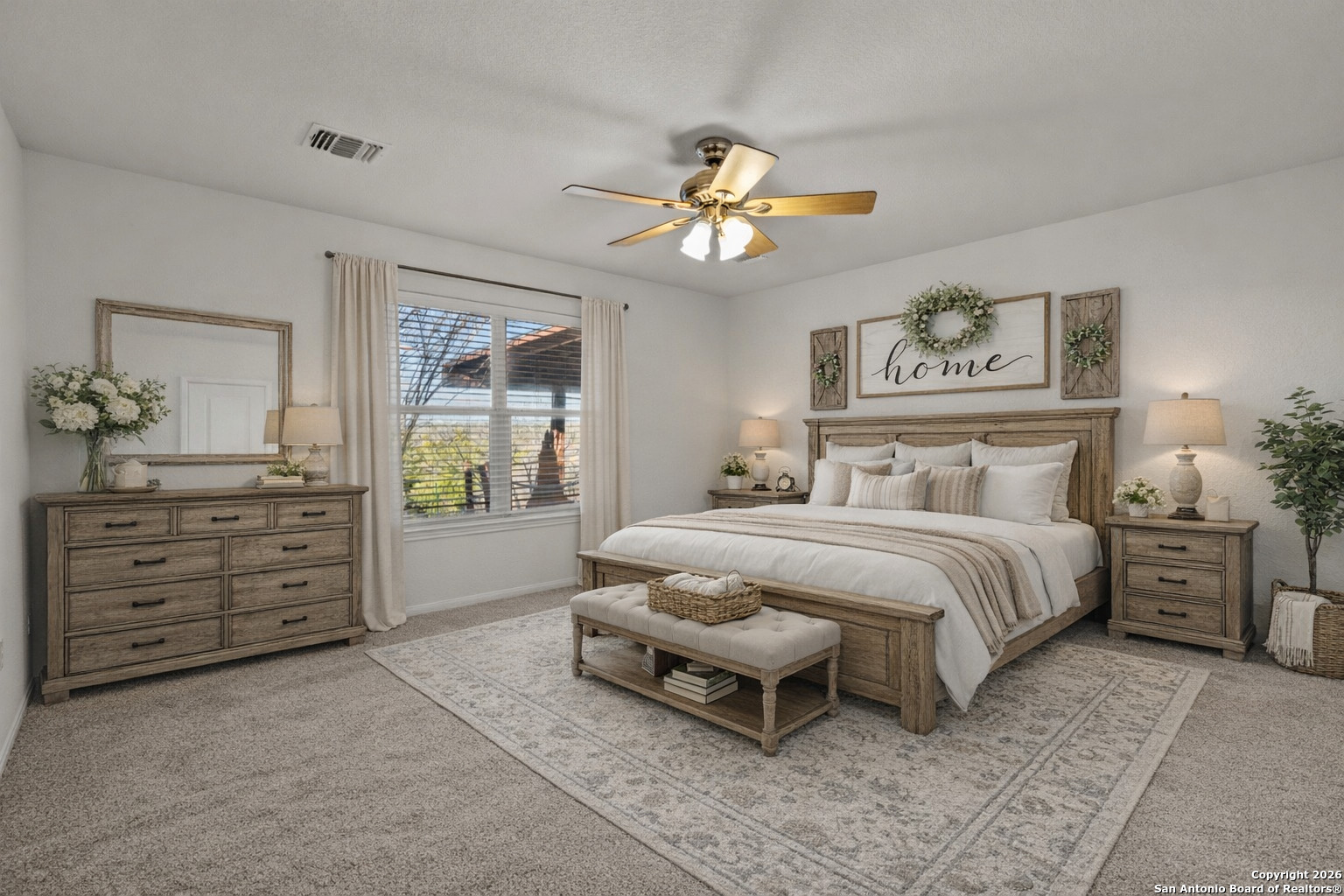 431 Windy Hill Drive Spring Branch, TX 78070 - Photo 17 of 45 a spacious bedroom with a bed and a chandelier