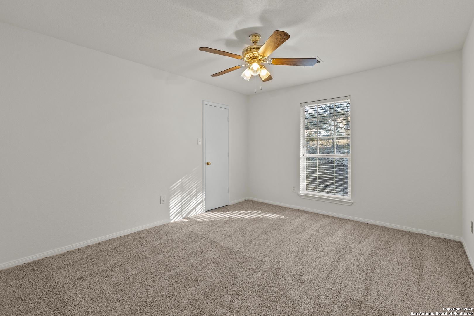 431 Windy Hill Drive Spring Branch, TX 78070 - Photo 20 of 45 a view of an empty room with a window