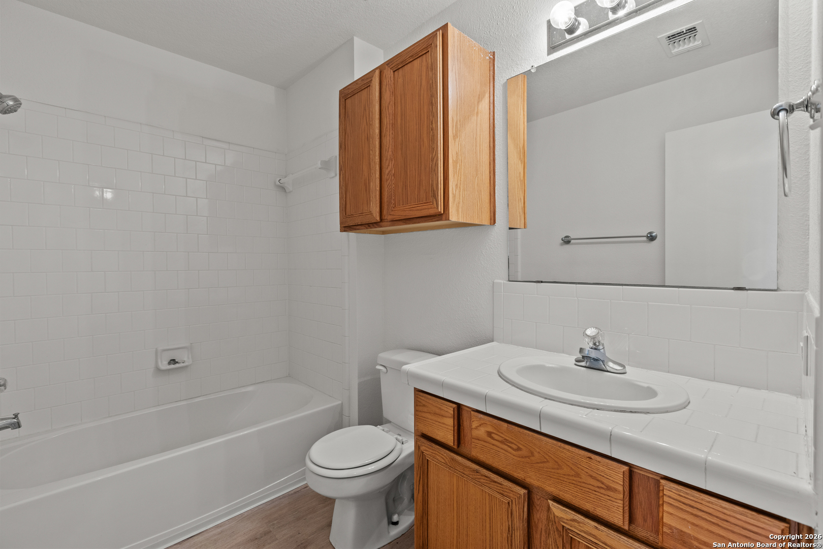 431 Windy Hill Drive Spring Branch, TX 78070 - Photo 22 of 45 a bathroom with a sink toilet and shower