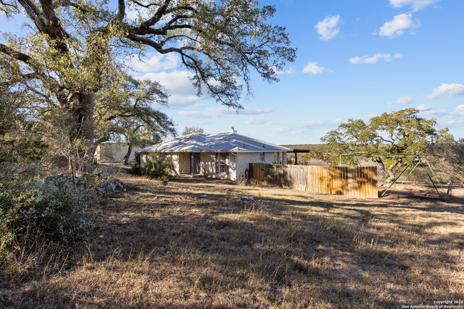 431 Windy Hill Drive Spring Branch, TX 78070 - Photo 30 of 45 a view of a house with a yard