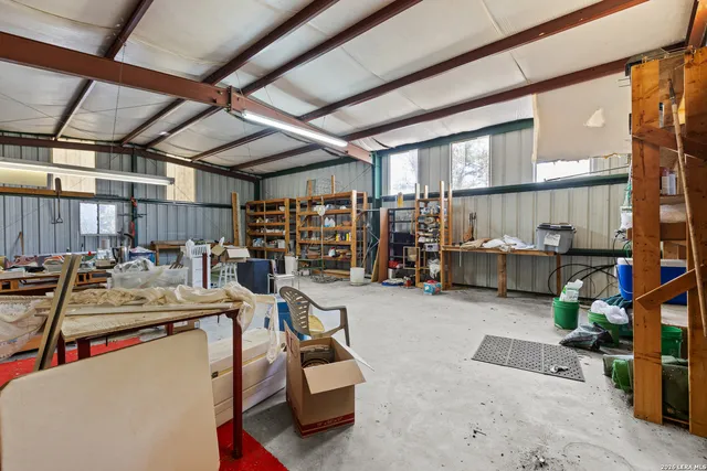 a view of a storage area with furniture and a rug