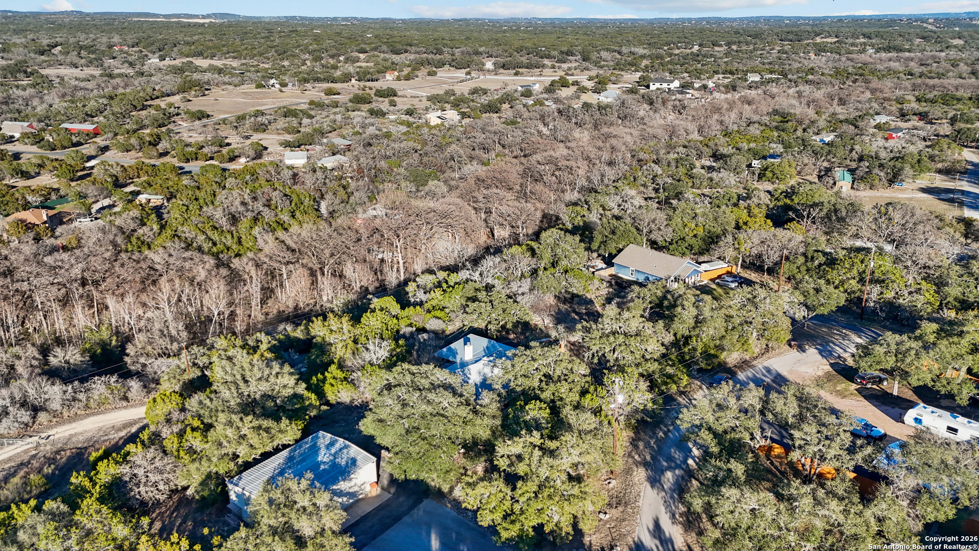 431 Windy Hill Drive Spring Branch, TX 78070 - Photo 39 of 45 an aerial view of a houses with a yard
