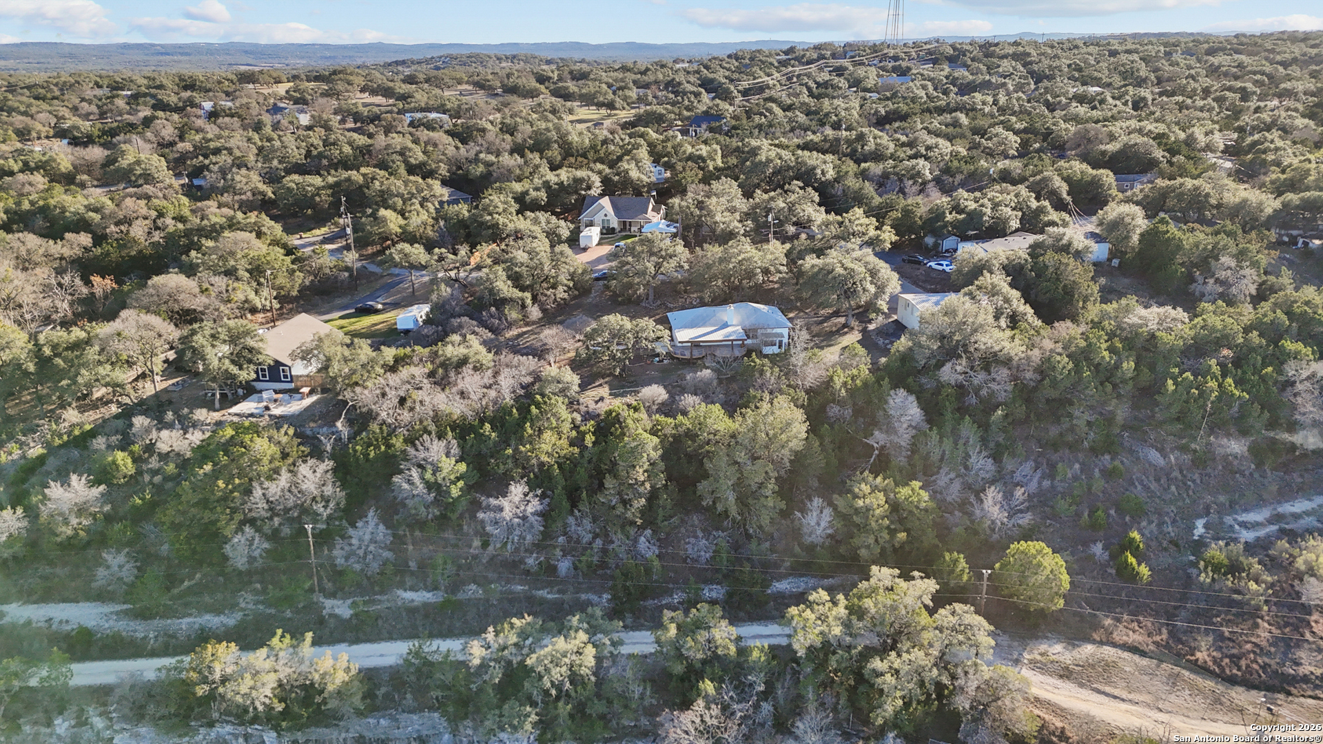 431 Windy Hill Drive Spring Branch, TX 78070 - Photo 41 of 45 an aerial view of house with yard
