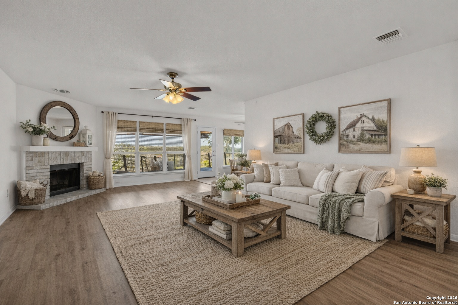 431 Windy Hill Drive Spring Branch, TX 78070 - Photo 7 of 45 a living room with furniture and a fireplace