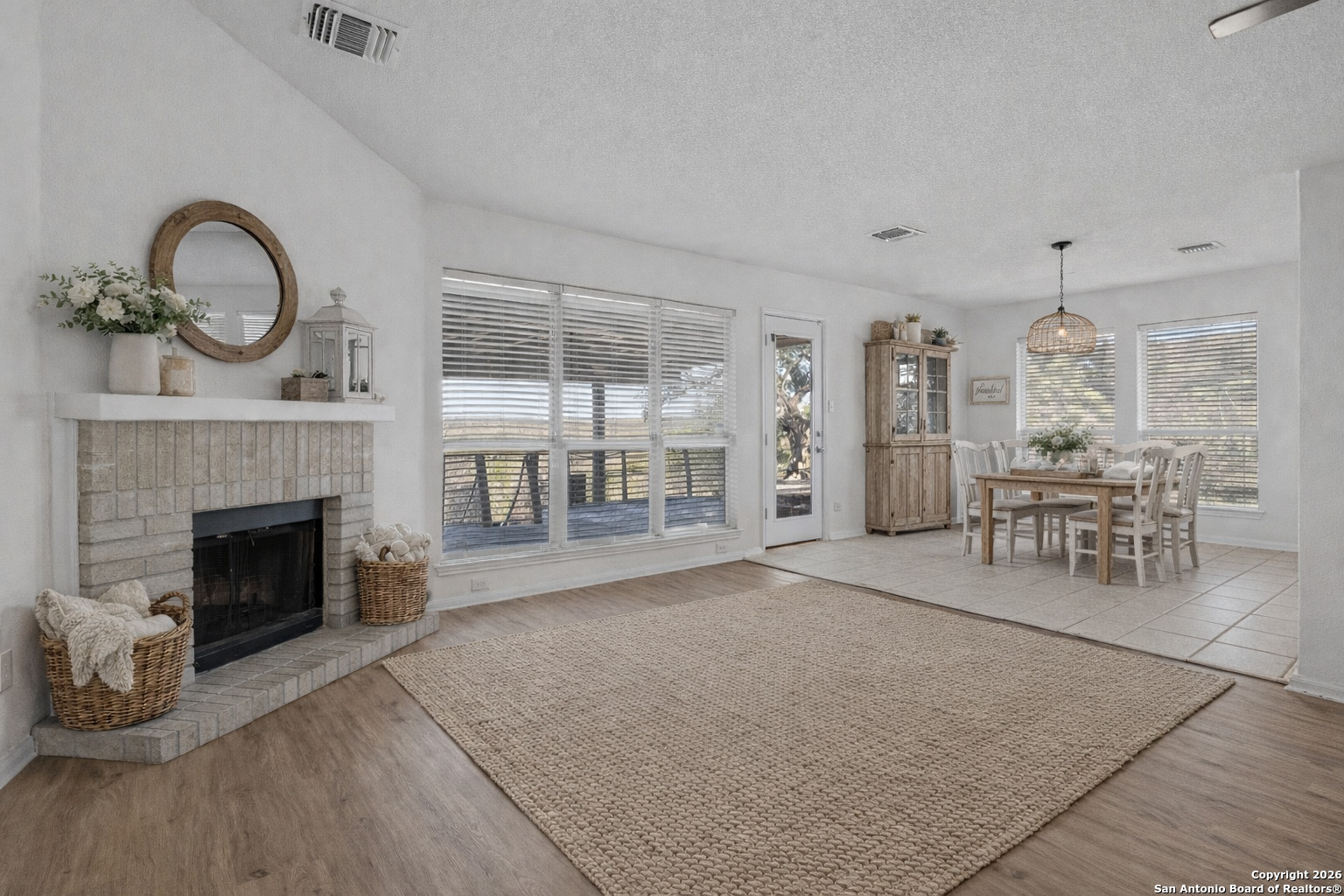 431 Windy Hill Drive Spring Branch, TX 78070 - Photo 9 of 45 a living room with furniture a window and fireplace