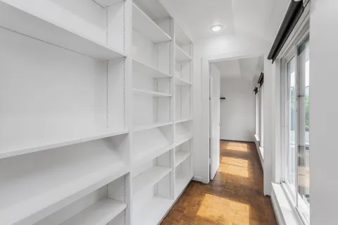a view of an empty walk in closet