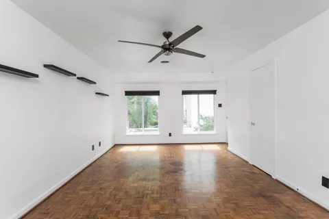 a view of an empty room with a window