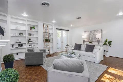 a living room with furniture and a rug