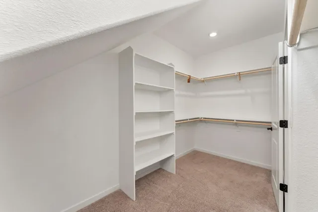 a view of an empty walk in closet