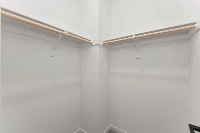 a view of an empty walk in closet