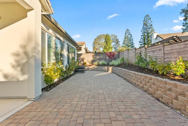 a view of a pathway along with potted plants