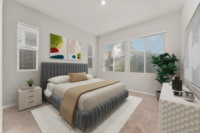 a bedroom with a large bed and a window