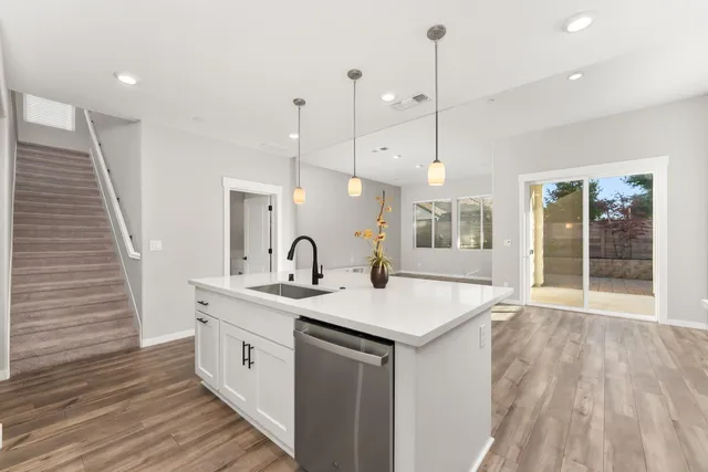 a kitchen with a sink and window