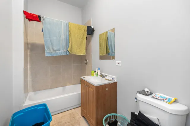 a bathroom with a sink toilet and bathtub