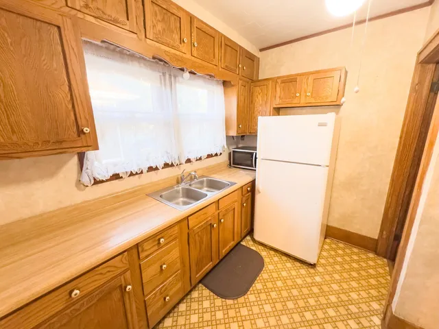 a utility room with sink dryer and washer
