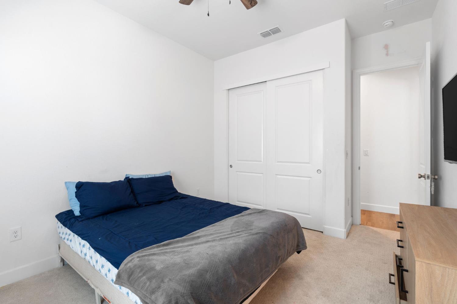 4314 Moro Cyn Street Rancho Cordova, CA 95742 - Photo 25 of 39 a bedroom with a bed and cabinet