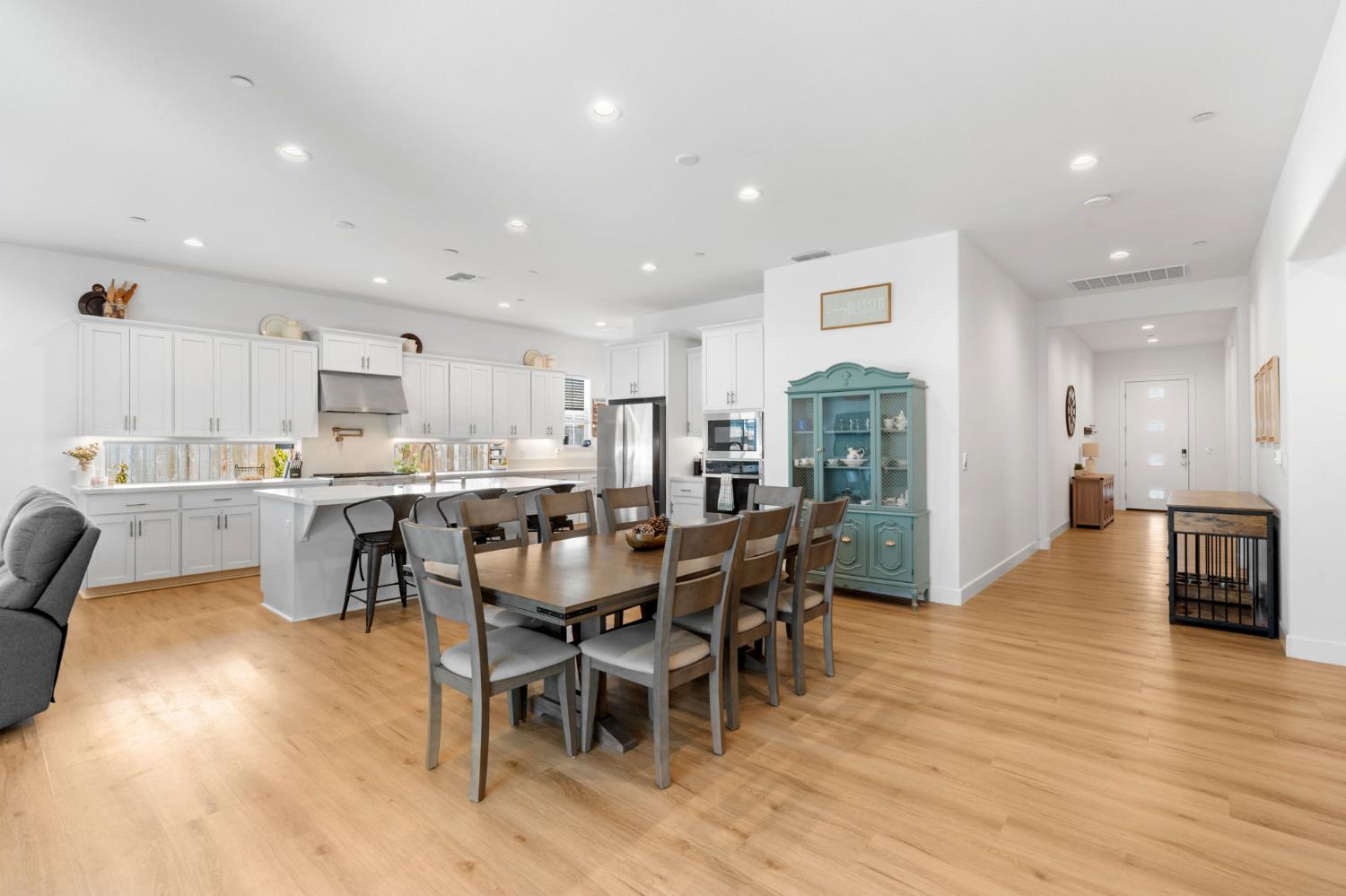 4314 Moro Cyn Street Rancho Cordova, CA 95742 - Photo 4 of 39 a view of a dining area kitchen with furniture and wooden floor