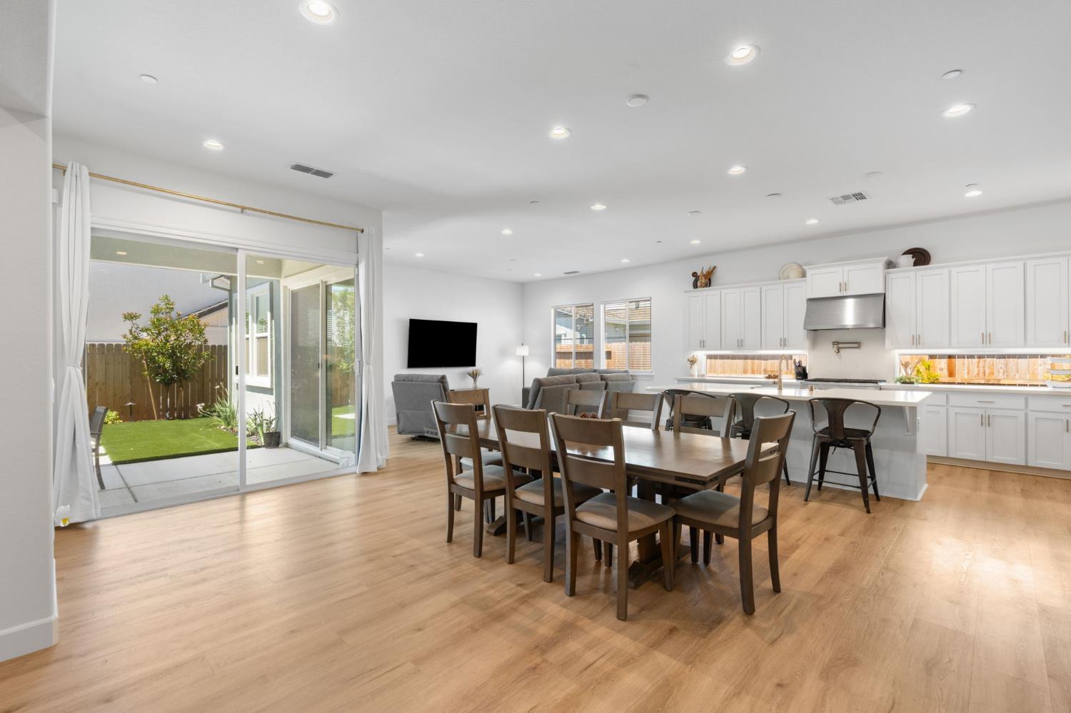 4314 Moro Cyn Street Rancho Cordova, CA 95742 - Photo 6 of 39 a view of a dining area with furniture window and wooden floor