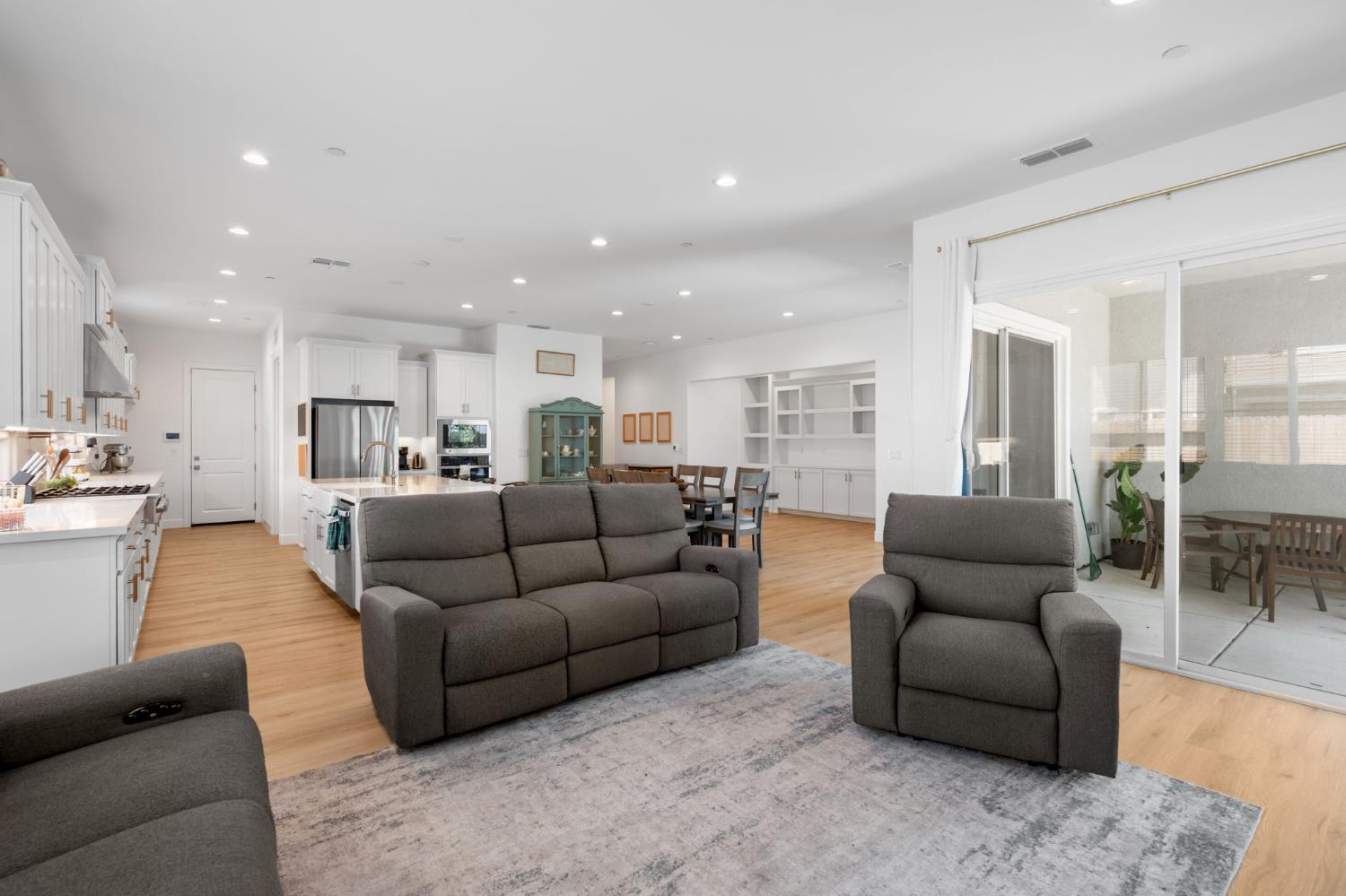 4314 Moro Cyn Street Rancho Cordova, CA 95742 - Photo 9 of 39 a living room with furniture and a view of kitchen