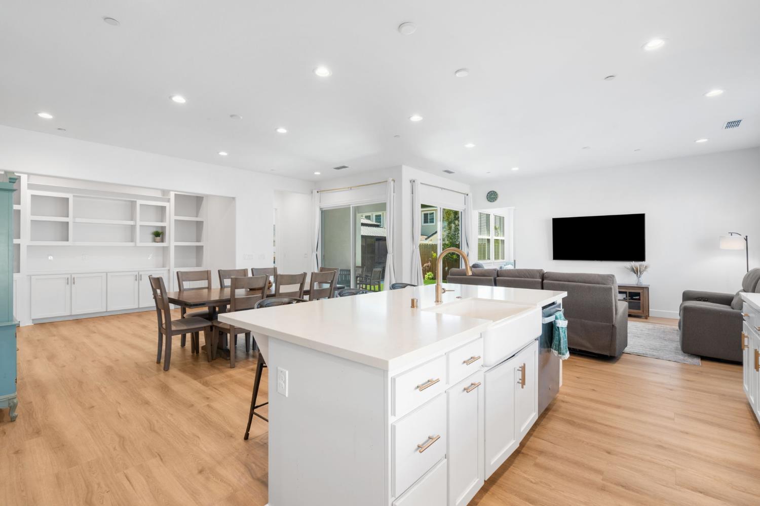 4314 Moro Cyn Street Rancho Cordova, CA 95742 - Photo 10 of 39 a large white kitchen with a large island in the center