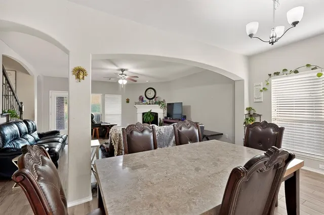 a bed room with two bed and a chair