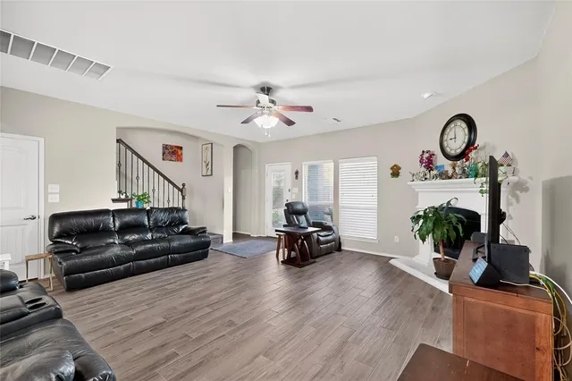 a living room with furniture and a fireplace