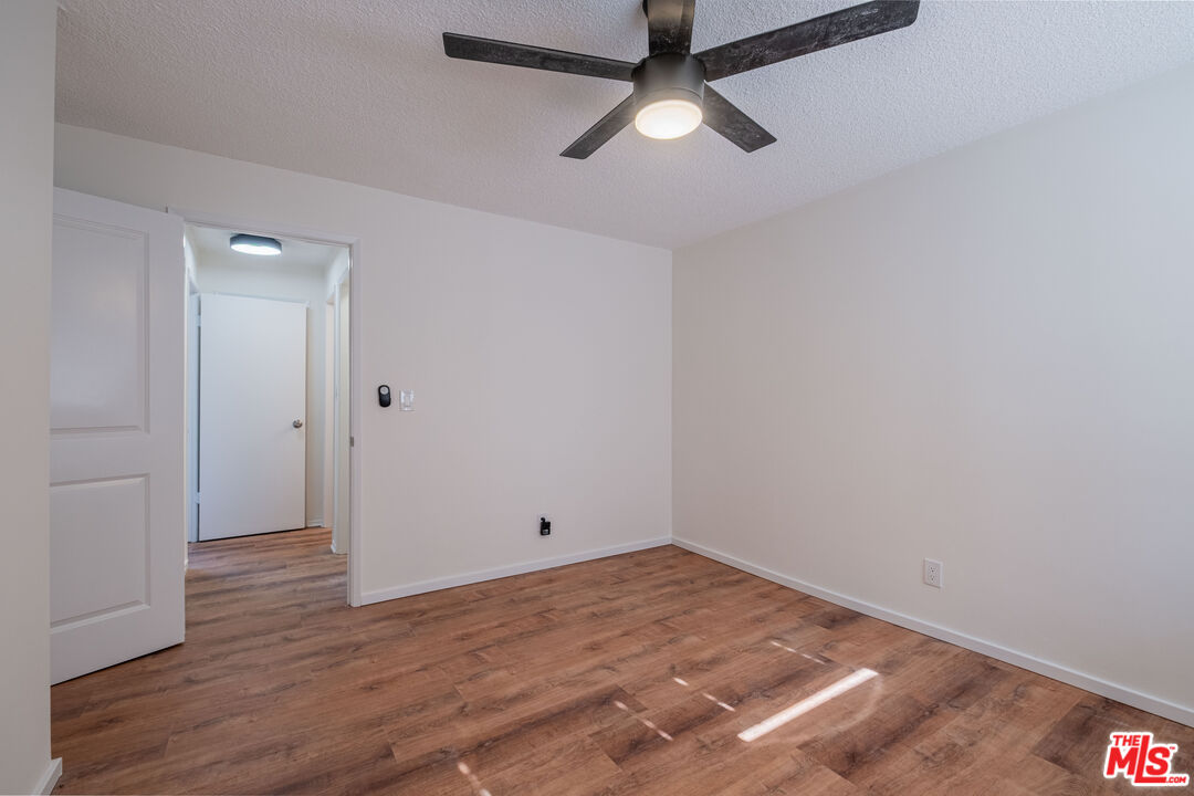 3826 Prospect Avenue, Unit 1 Culver City, CA 90232 - Photo 15 of 20 an empty room with wooden floor and ceiling fan