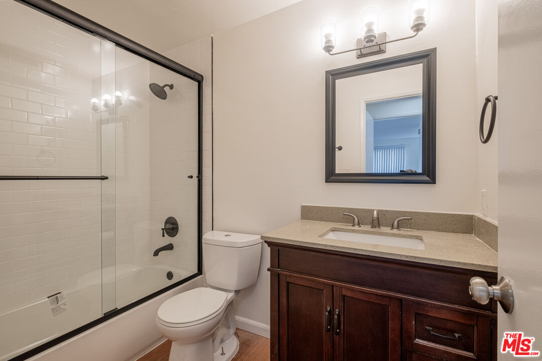 3826 Prospect Avenue, Unit 1 Culver City, CA 90232 - Photo 17 of 20 a bathroom with a sink a toilet a mirror and shower