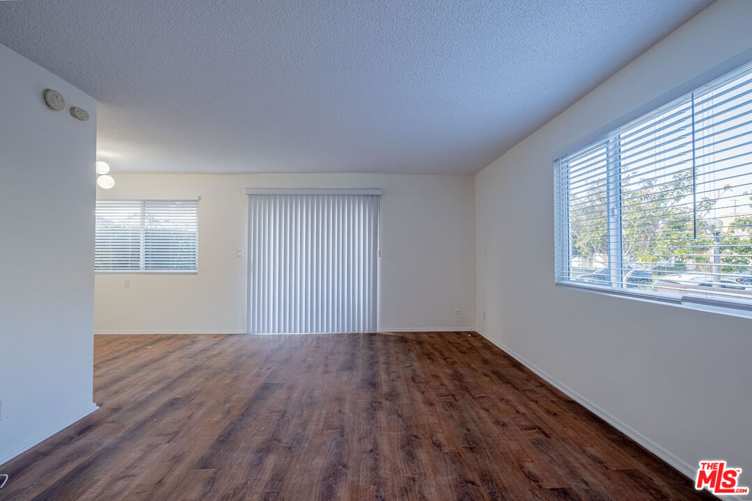 3826 Prospect Avenue, Unit 1 Culver City, CA 90232 - Photo 8 of 20 a view of an empty room with wooden floor and a window