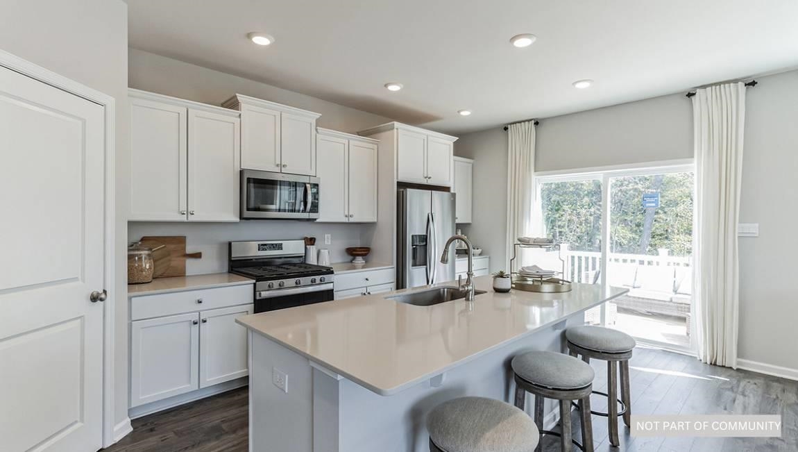 505 Scotty, Unit 1301 Rio Grande, NJ 08242 - Photo 4 of 25 a kitchen with sink a microwave and cabinets