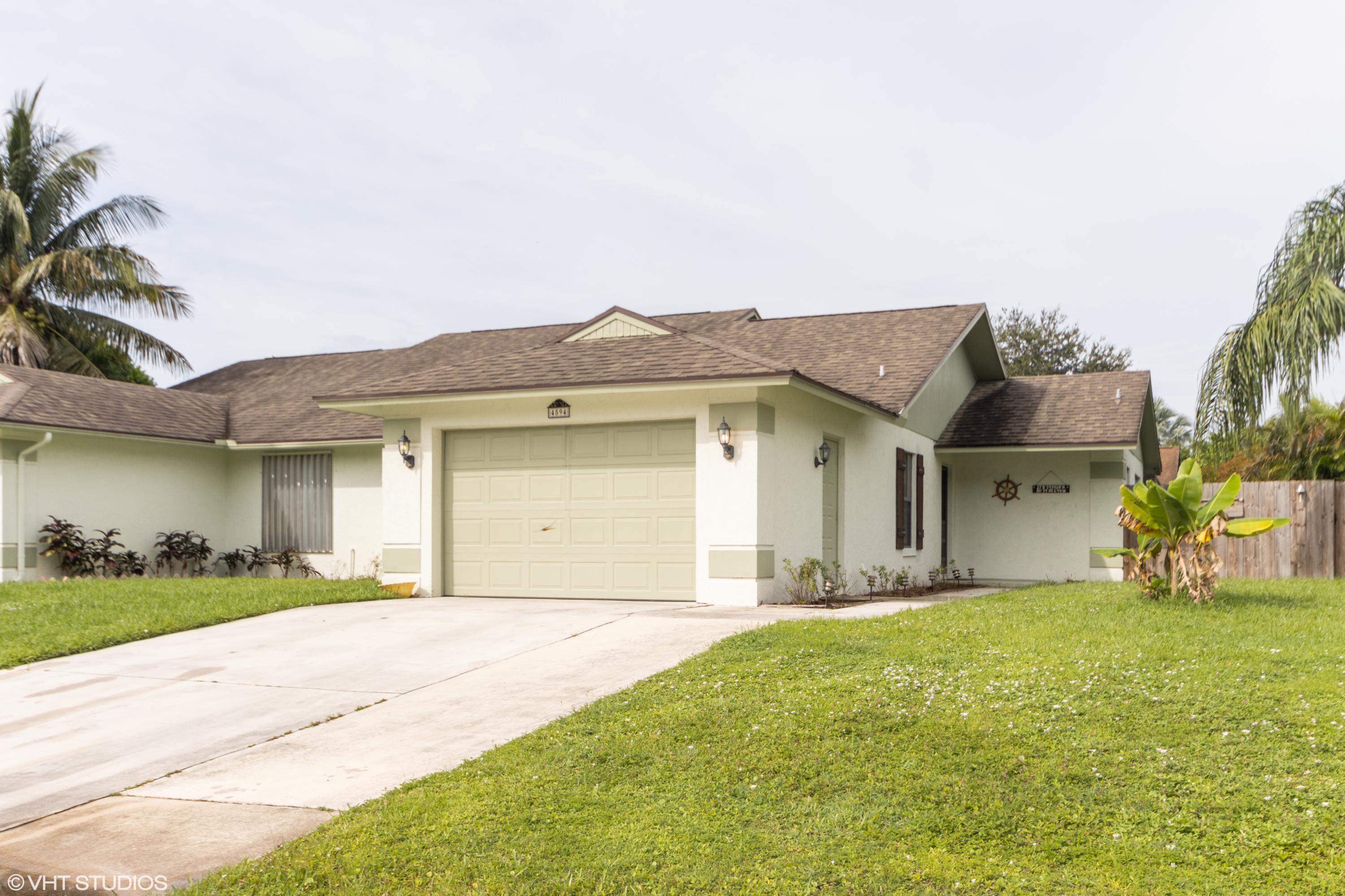 4594 Southeast Geneva Drive Stuart, FL 34997 - Photo 2 of 20 02_4594SEGenevaDrive_2002_HiRes