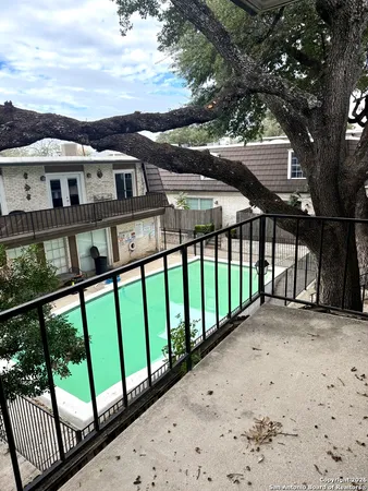 a view of a white house with a large window