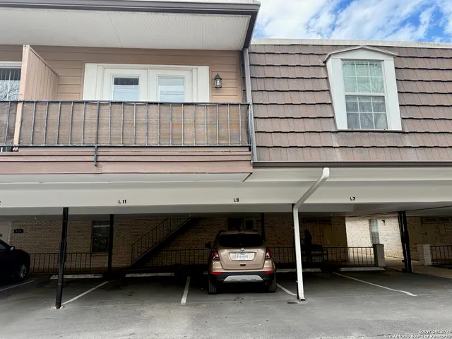 a view of a car park in front of house