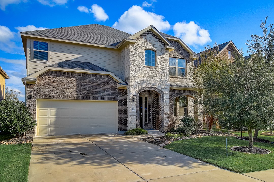 2465 Millbrook Loop Leander, TX 78641 - Photo 1 of 1 a front view of a house with garden