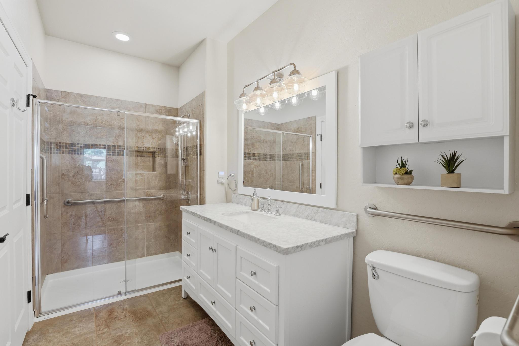 5501 Solitude Trail Loop Pine, AZ 85544 - Photo 17 of 27 a bathroom with a granite countertop sink toilet and shower